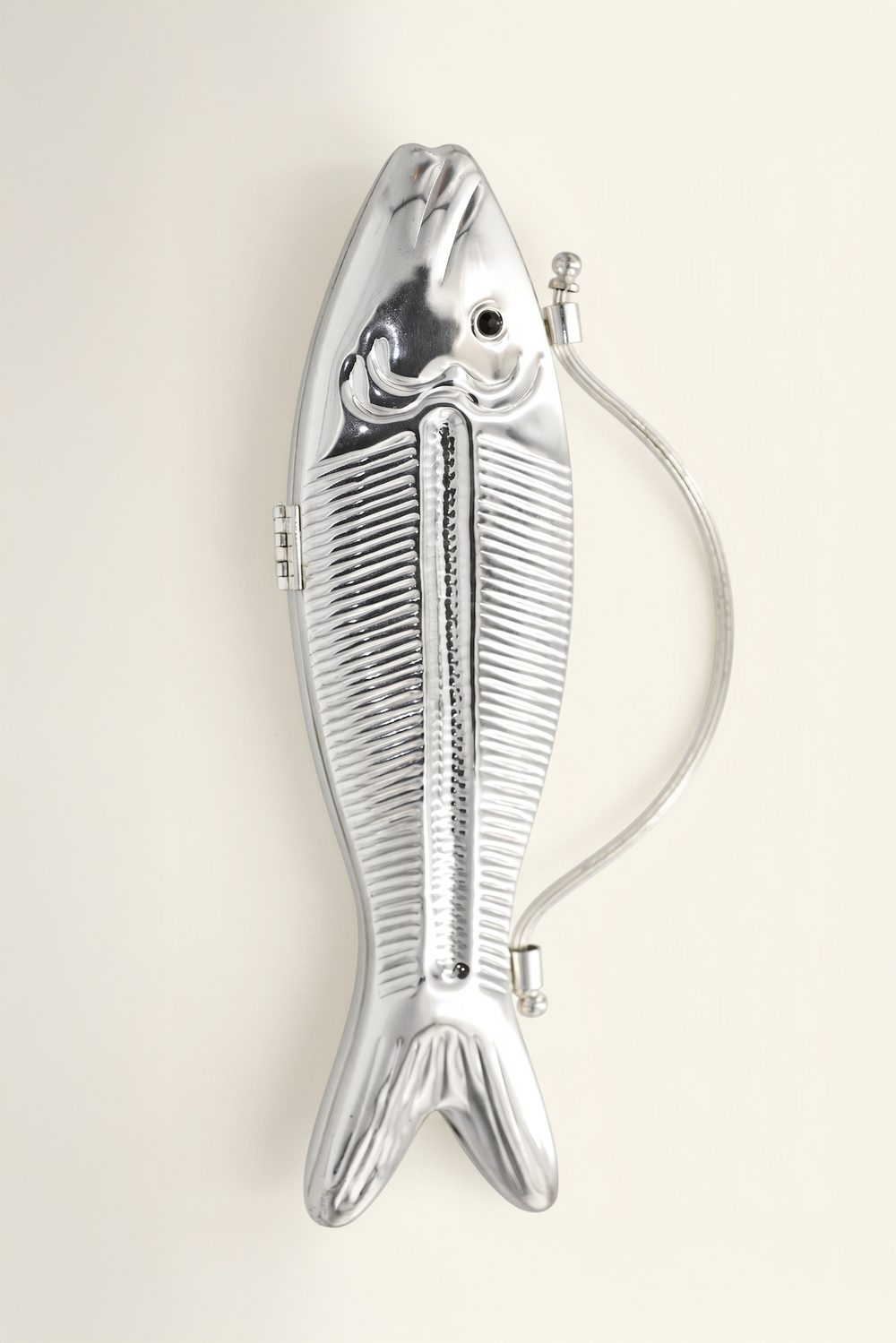 Onyx Koi silver-finish fish-shaped metal clutch with black stone eye
